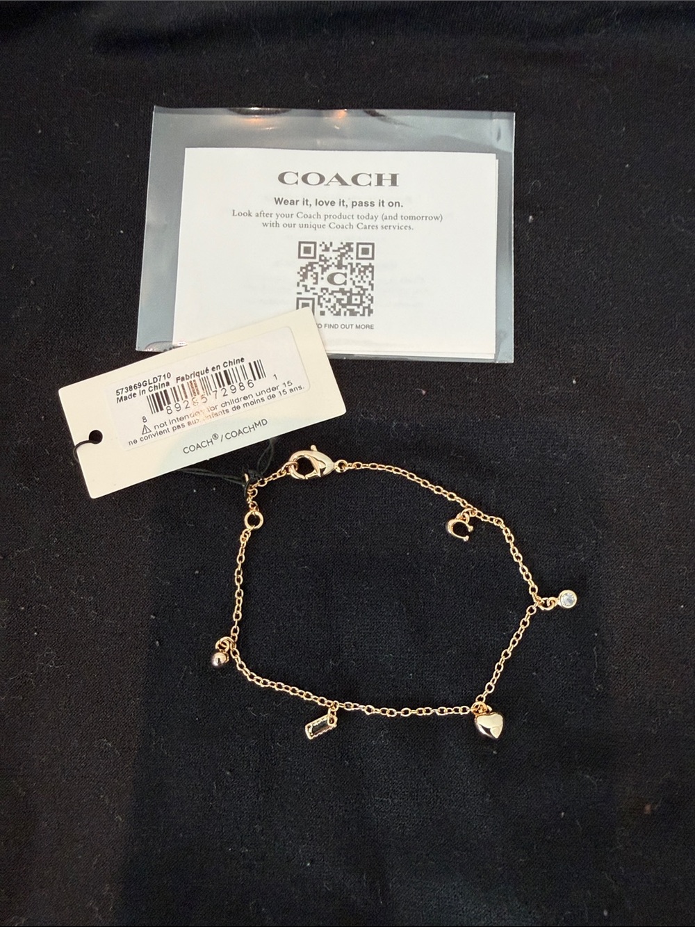 Coach Gold-Tone Charm Bracelet with Heart and Crystal Accents